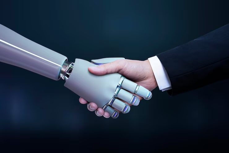 Aperto de mão futurista entre uma mão humana e uma mão robótica contra um fundo azul escuro, representando a integração da tecnologia e da interação humana.