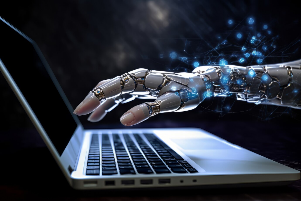 Uma mão robótica interagindo com um laptop, destacando o avanço da inteligência artificial na computação e a interface entre a tecnologia e os humanos, em um fundo escuro com efeitos de luz azul.